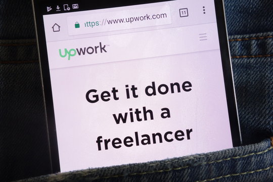 KONSKIE, POLAND - JUNE 02, 2018: Upwork website displayed on smartphone hidden in jeans pocket