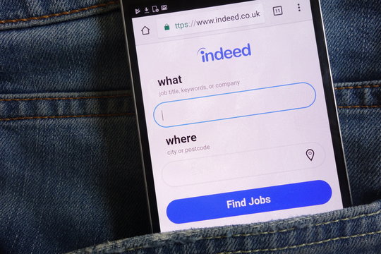 KONSKIE, POLAND - JUNE 02, 2018: Indeed website displayed on smartphone hidden in jeans pocket