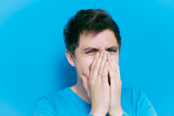 man laughs and covers her mouth