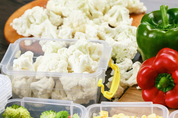 Trays with raw cauliflower for freezing.