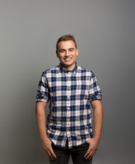 Obraz premium Studio portrait of a happy young man