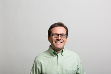 Obraz premium Studio portrait of an excited professional man