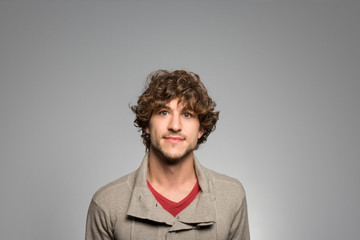 Fototapeta premium Studio portrait of a thoughtful young man