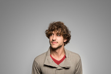 Obraz premium Studio portrait of a thoughtful young man
