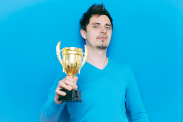 man with a golden cup