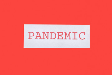 top view of pandemic lettering isolated on red