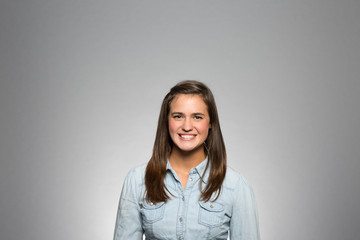 Obraz premium studio portrait of an excited young woman 