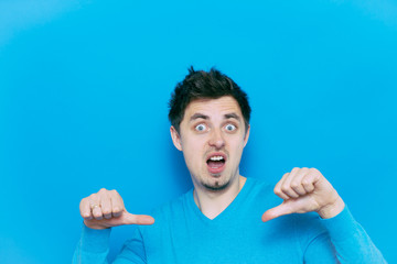 man showing a thumb down gesture