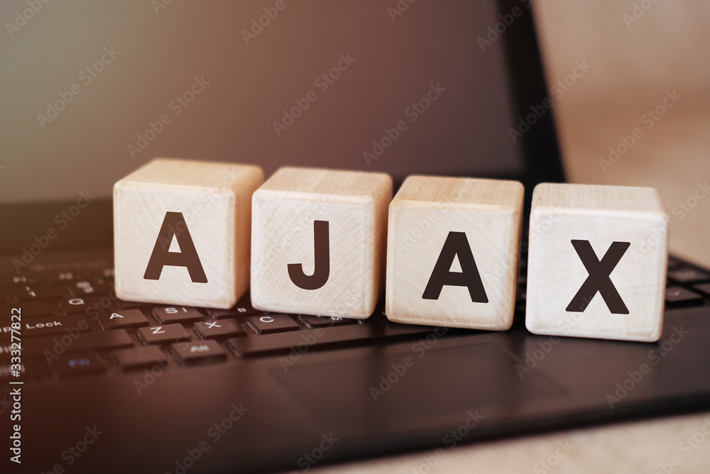 Poster ajax - programming text on a wooden cube on a black laptop