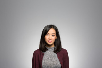 Fototapeta premium Studio portrait of a thoughtful young woman
