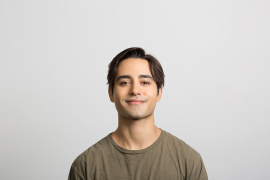 Studio portrait of a confident young man
