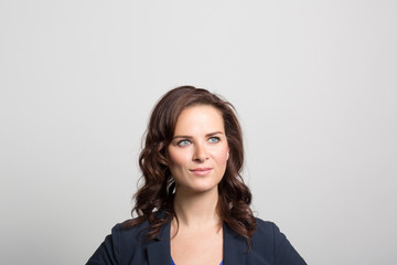 Obraz premium Studio portrait of a thoughtful young woman