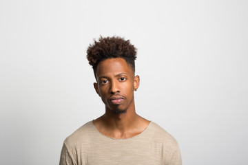 Obraz premium Studio portrait of a pensive young man 