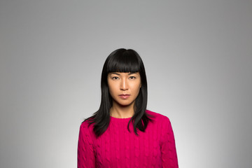 Fototapeta premium Studio portrait of a pensive woman 
