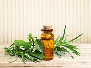 The fresh herbal and essential oil in a glass bottle