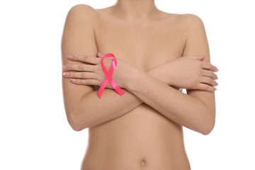 Naked woman with pink ribbon on white background, closeup. Breast cancer awareness