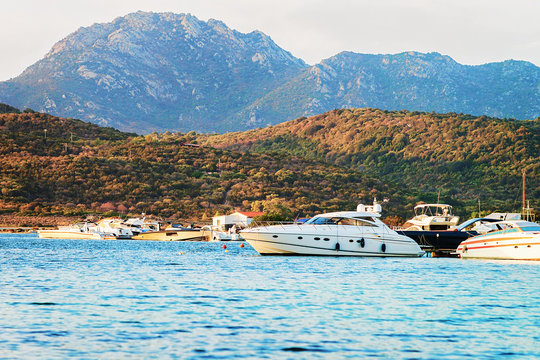 Sunrise with yachts in at Mediterranean sea Sardinia