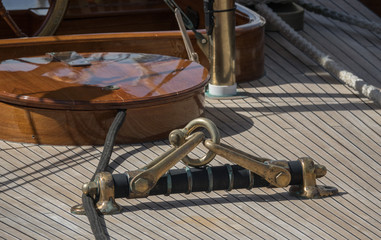 Ship's wheel, rudder marine vintage on an old Sailboat. Nautical detail