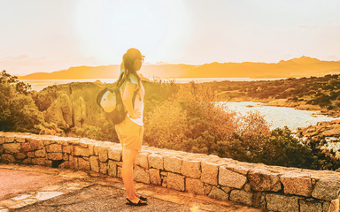 Girl looking at Capo Ferro in Sardinia Italy reflex