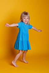 little girl in a blue dress dance