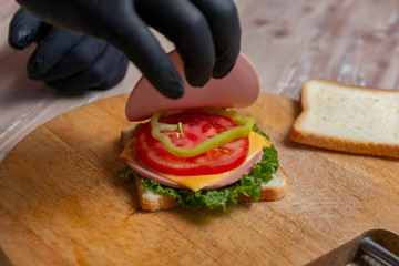 Process of cooking sandwich. variety of fillings and ingredients.Homemade Fast Food concept