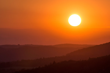 Sunset with small hills