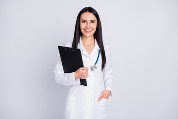 Photo of beautiful cheerful professional practitioner intern lady good mood hold patient papers medical prescriptions wear white lab coat stethoscope isolated grey color background