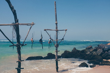 Pole fishermen in the ocean Sri Lanka