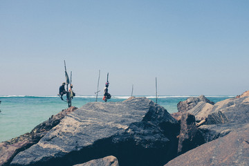 Pole fishermen in the ocean Sri Lanka