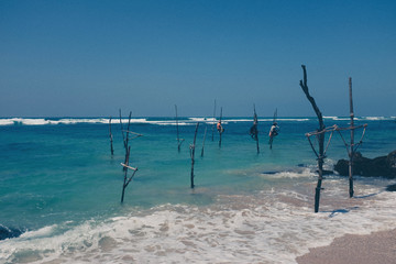 Pole fishermen in the ocean Sri Lanka