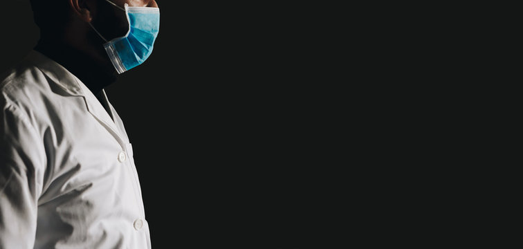 Panoramic Medical Coronavirus Banner With Space For Text. Unrecognizable Tired Medical Assistant, Doctor COVID 19 On Black Background