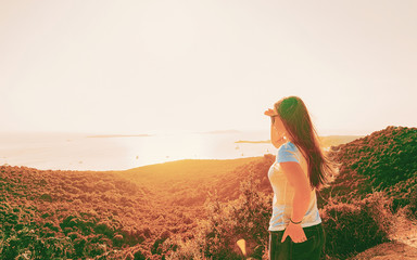 Girl looking at Mediterranean Sea in Sardinia Italy reflex