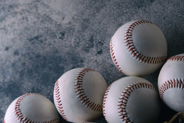 Baseball balls on gray texture background with copy space for sport.