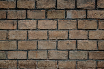 background of old authentic brick wall at Chernivtsi University. Handmade brick textured unique colors, the work of true craftsmen