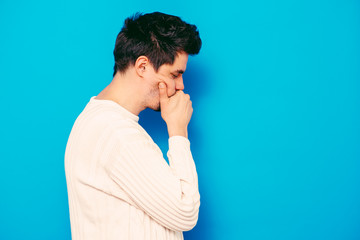 Young businessman holding head in his hands