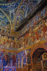 Fototapeta na wymiar Frescos on interior of Humor Monastery located in Gura Humorului, Romania, is one of the first of Moldova's painted monasteries.