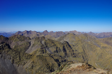 Fototapeta na wymiar Panorama of the Pyrenees mountains in Andorra, from top of Coma Pedrosa peak.