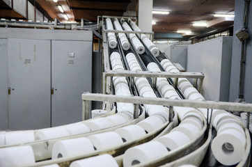 Production of Toilet paper in factory. Toilet paper rolls making machine. Tissue and Kitchen Towels...