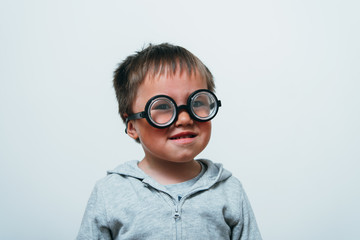 Little boy in funny glasses