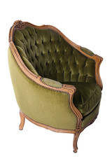 Luxurious, antique green armchair on a white, isolated background. Old, palace furniture. Side view.