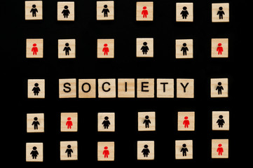 Wooden figures on black background. Society concept. Imagine. Man and woman. Sign. Infection.  