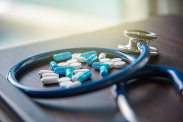 pills and Stethoscope in clinic of hospital