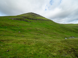 Faroe Islands. Green grass slope of mountain