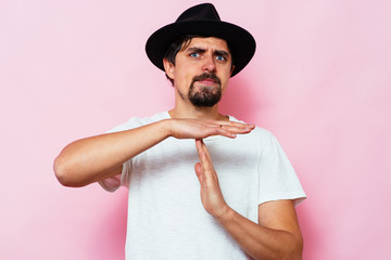 A man shows the hands stop timeout.