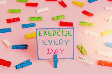 Word writing text Exercise Every Day. Business photo showcasing move body energetically in order to get fit and healthy Colored clothespin papers empty reminder pink floor background office pin