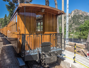 Historic wooden train Tram between Soller and Palma with views over the Soller village and mountains range Serra de Tramuntana, Mallorca Balearic Islands