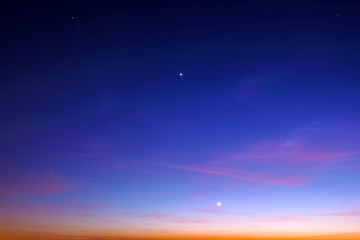 blue starry sky landscape at dusk against red sunset clouds background wide view of universe with stars and moon Constellation in deep space Bright planet at twilight Astronomy nature wallpaper