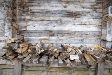 Firewood storage near the wall of village building