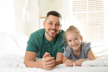 Dad and daughter spending time together at home. Happy Father's Day