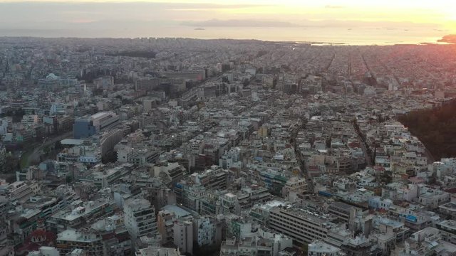 Aerial view of Acropolis of Athens, the Temple of Athena Nike, Parthenon, Hekatompedon Temple, Sanctuary of Zeus Polieus, Odeon of Herodes Atticus, Erechtheion at sunset